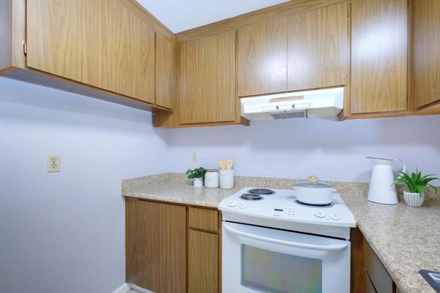 kitchen featuring white range with electric cooktop