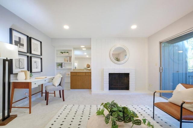 living room featuring a brick fireplace and light colored carpet