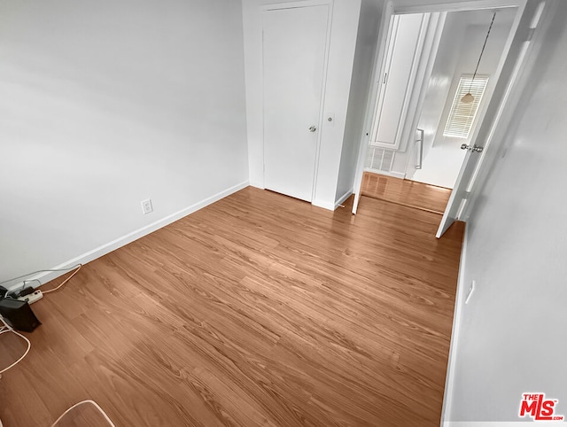 spare room featuring light hardwood / wood-style flooring