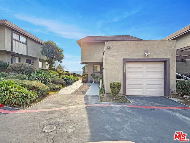 townhome / multi-family property featuring a garage