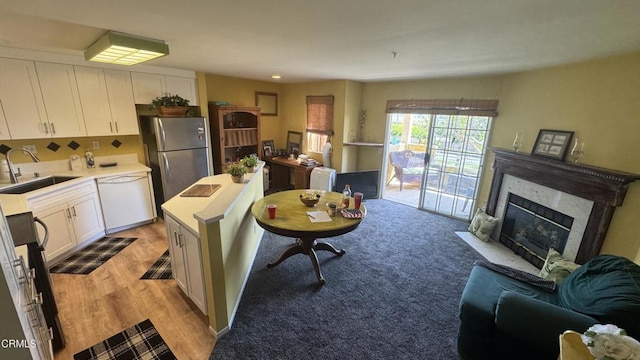 2713 Antonio Dr Unit 104, Camarillo, CA 93010 - living room with a premium fireplace and light wood-type flooring