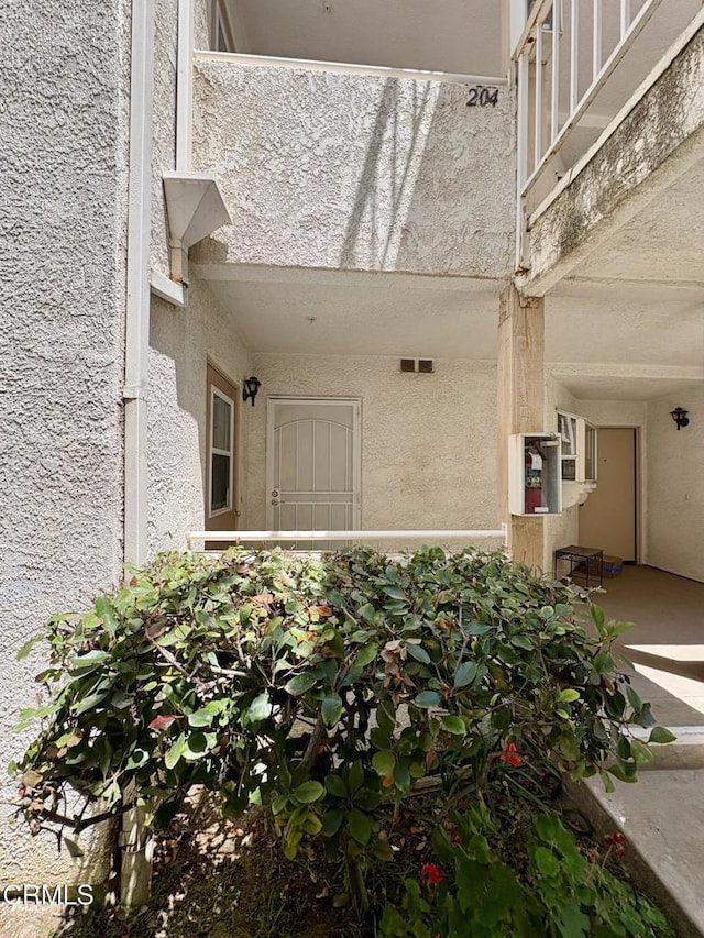 2713 Antonio Dr Unit 104, Camarillo, CA 93010 - doorway to property with stucco siding