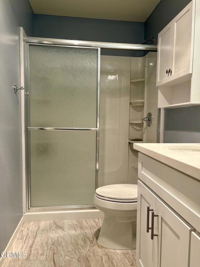 2713 Antonio Dr Unit 104, Camarillo, CA 93010 - bathroom featuring marble look tiles, a shower stall, and vanity