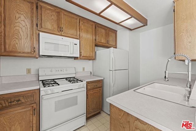 kitchen with sink and white appliances