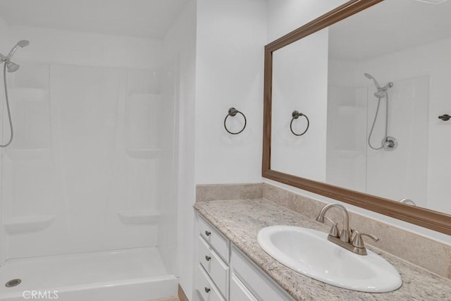 bathroom featuring vanity and walk in shower