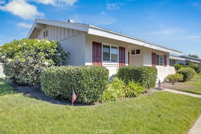 view of property exterior featuring a yard