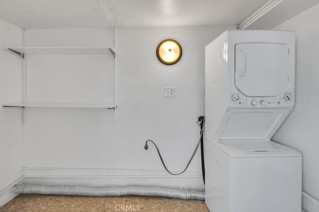 laundry area with stacked washer / dryer