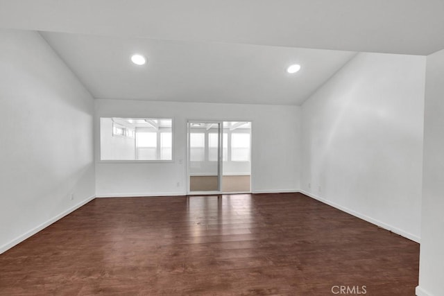 empty room with dark hardwood / wood-style floors