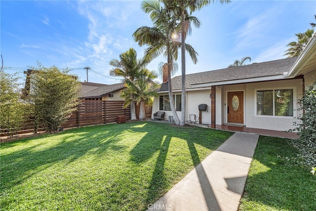 exterior space featuring a front lawn