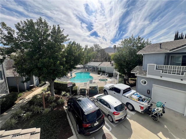 exterior space with a fenced in pool