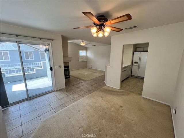 unfurnished room featuring light carpet