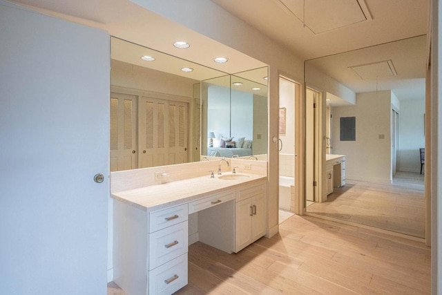 bathroom featuring vanity and hardwood / wood-style floors