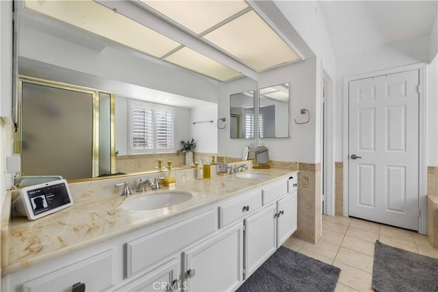 bathroom featuring tile patterned flooring, vanity, shower with separate bathtub, and tile walls