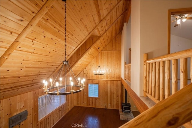 bonus room with dark wood-type flooring, an inviting chandelier, vaulted ceiling, wooden ceiling, and wood walls