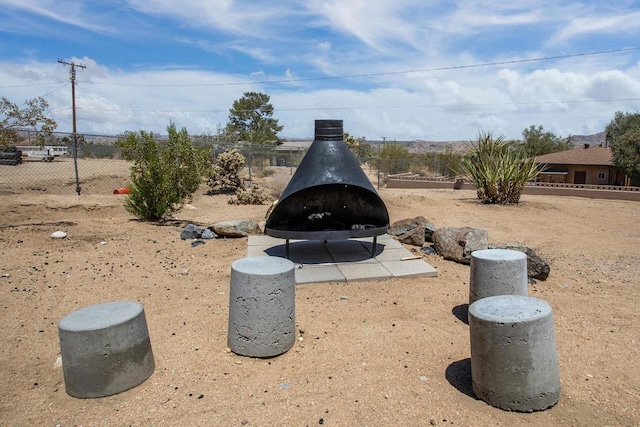 details featuring a wood stove and a fire pit