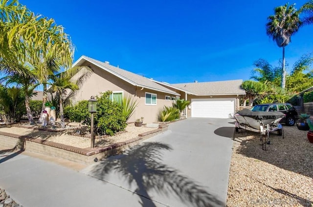 ranch-style home featuring a garage