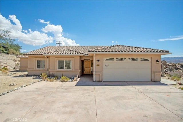 mediterranean / spanish house featuring a garage