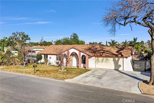 single story home featuring a garage and a front lawn