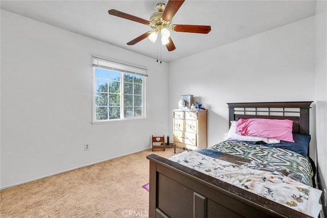 bedroom with light colored carpet and ceiling fan