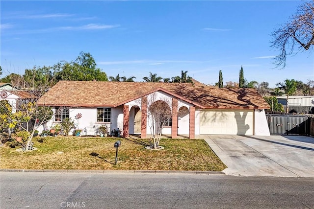 single story home featuring a garage and a front yard