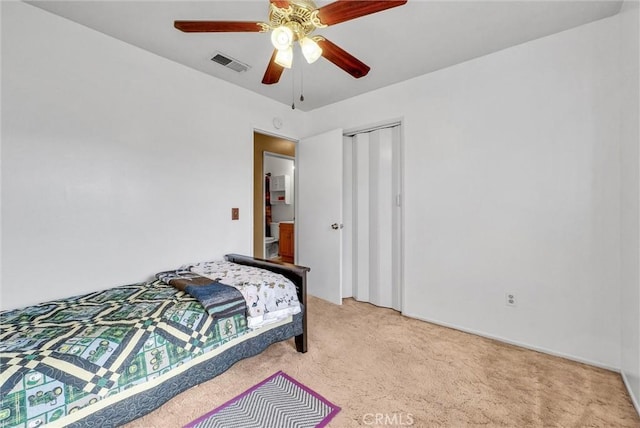 carpeted bedroom with ceiling fan