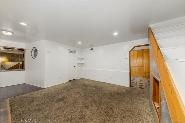 empty room with visible vents, recessed lighting, and carpet floors