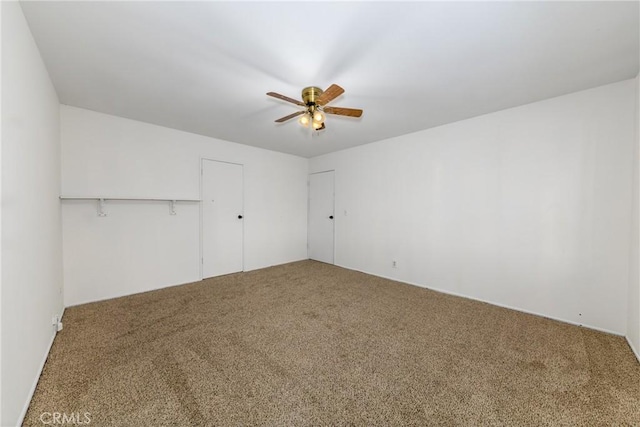 unfurnished bedroom with a ceiling fan and carpet floors