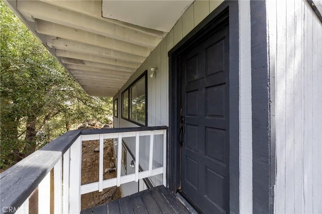 doorway to property featuring a balcony