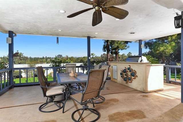 view of patio featuring area for grilling and ceiling fan