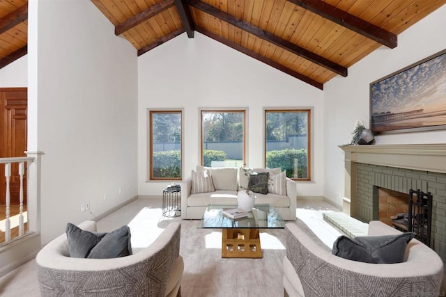 living room with plenty of natural light, a fireplace, and wooden ceiling