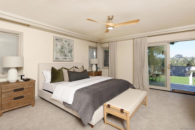 carpeted bedroom with ceiling fan, ornamental molding, and access to outside