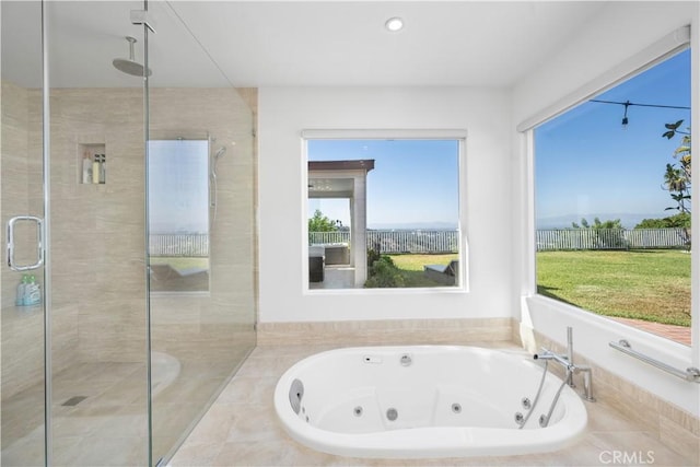 bathroom with shower with separate bathtub