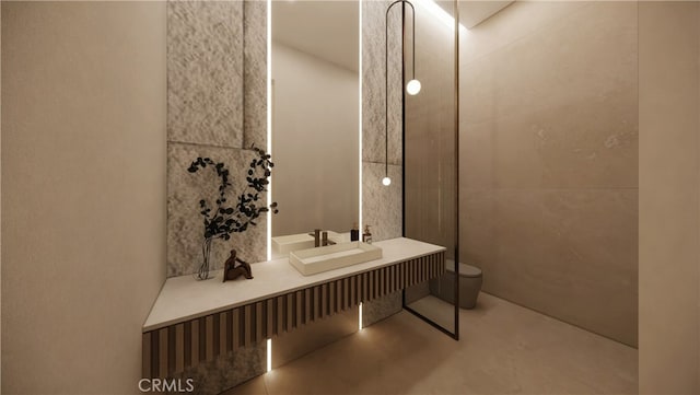 bathroom featuring toilet and concrete flooring