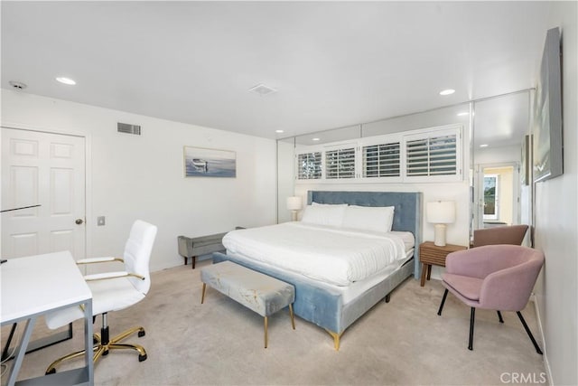 bedroom featuring light carpet