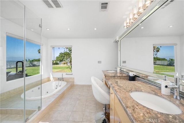 bathroom with tile patterned flooring, vanity, and independent shower and bath