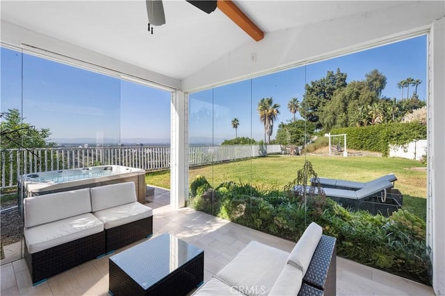 view of patio with outdoor lounge area and a hot tub