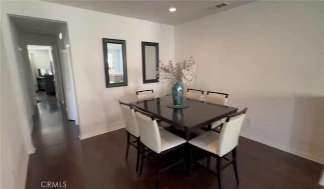 dining area with dark wood-type flooring