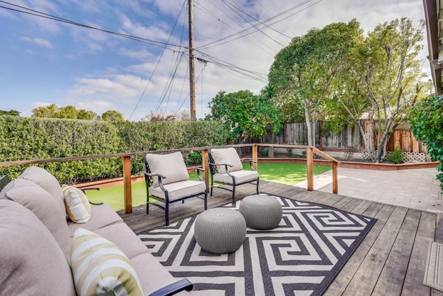 wooden deck with an outdoor living space