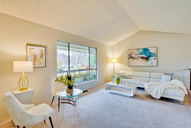 carpeted living room with lofted ceiling and a textured ceiling