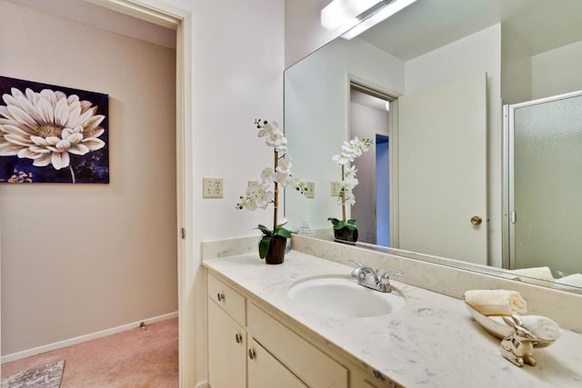 bathroom with vanity and walk in shower