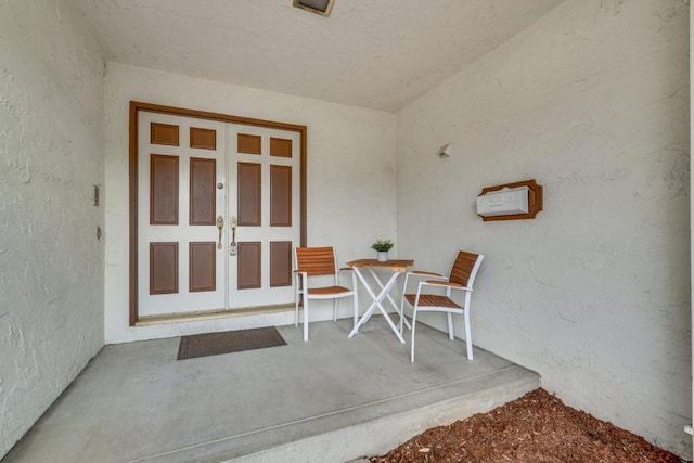 property entrance with french doors