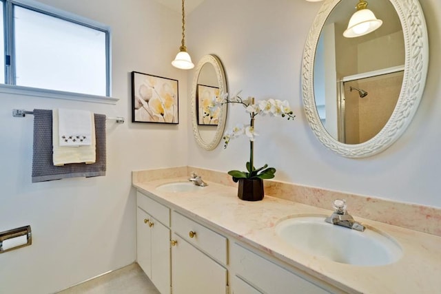 bathroom featuring vanity and a shower