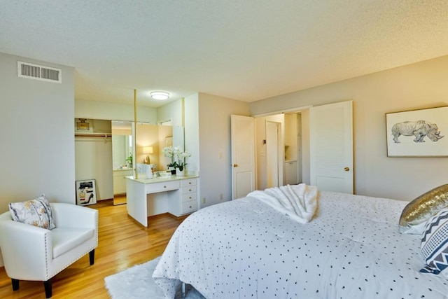 bedroom featuring a closet and light wood-type flooring