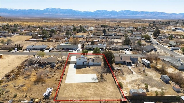 drone / aerial view featuring a mountain view