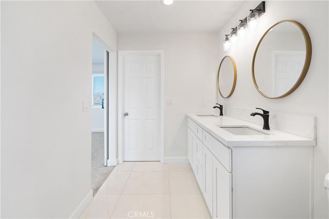 bathroom with tile patterned floors and vanity