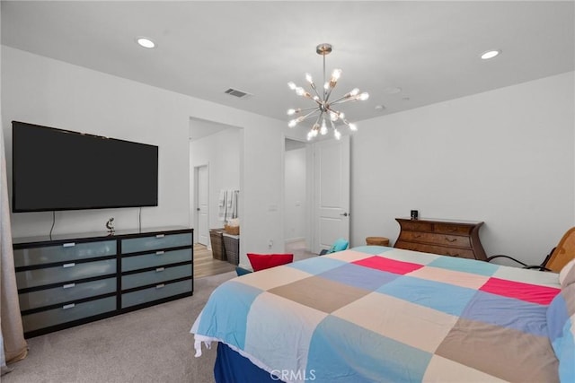 bedroom featuring light carpet and a chandelier