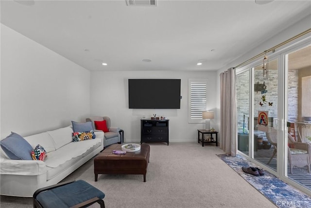 living room featuring light colored carpet