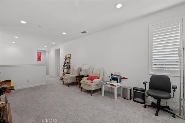 living area with light colored carpet