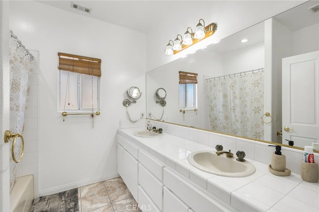 bathroom featuring tile patterned floors and vanity