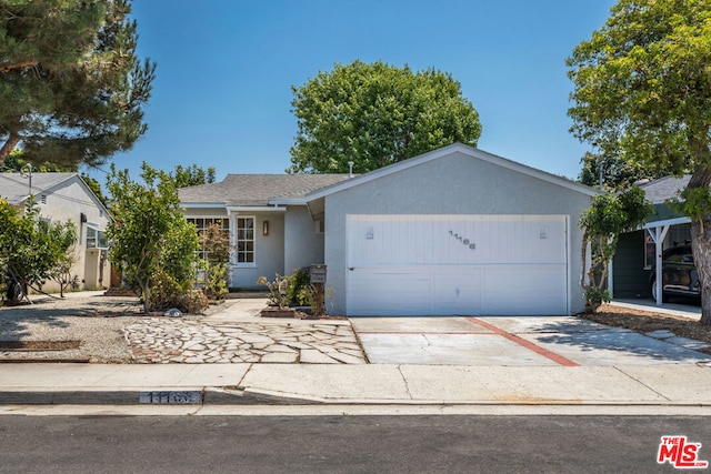 single story home featuring a garage